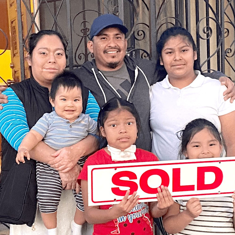 Perfecto Homes client holding the keys to their new home